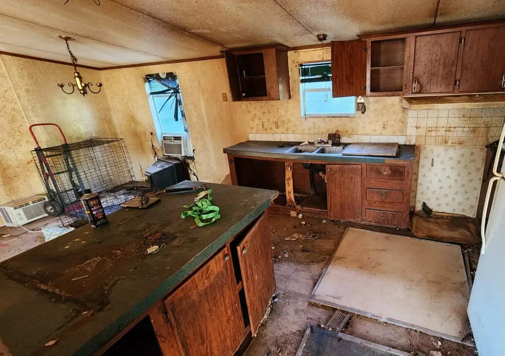 The kitchen of a house we bought on Woodhaven Dairy Road in Summerdale, Alabama, before the work